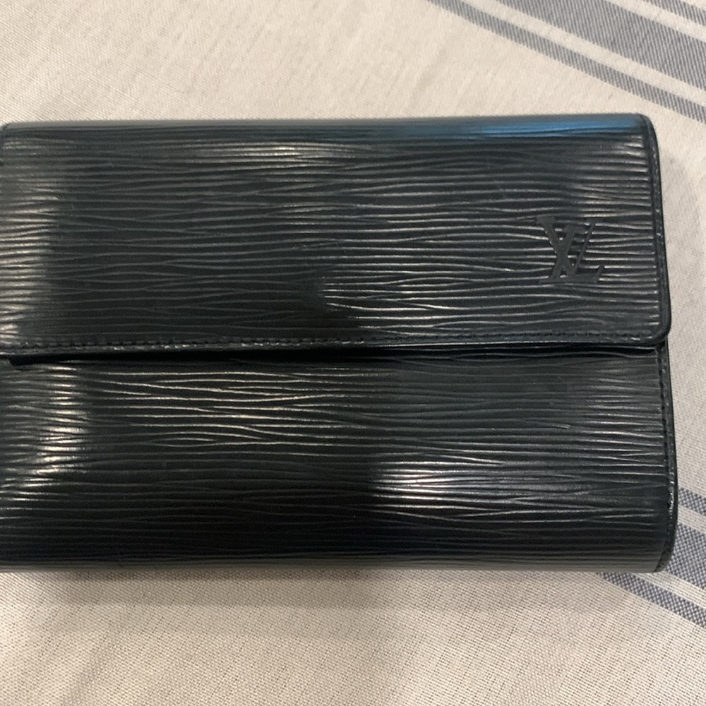 Louis Vuitton, black Epi leather porte trend Tri-fold wallet.